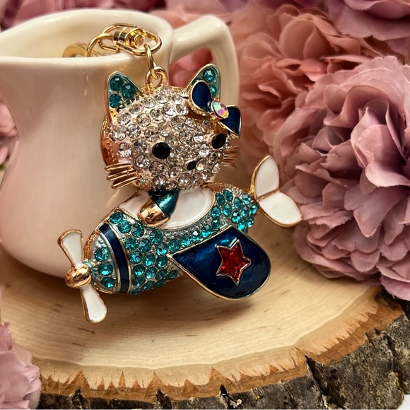 Hello Kitty Flying a Bkue Crystal Airplane Keychain Charm - Picture 6 of 16